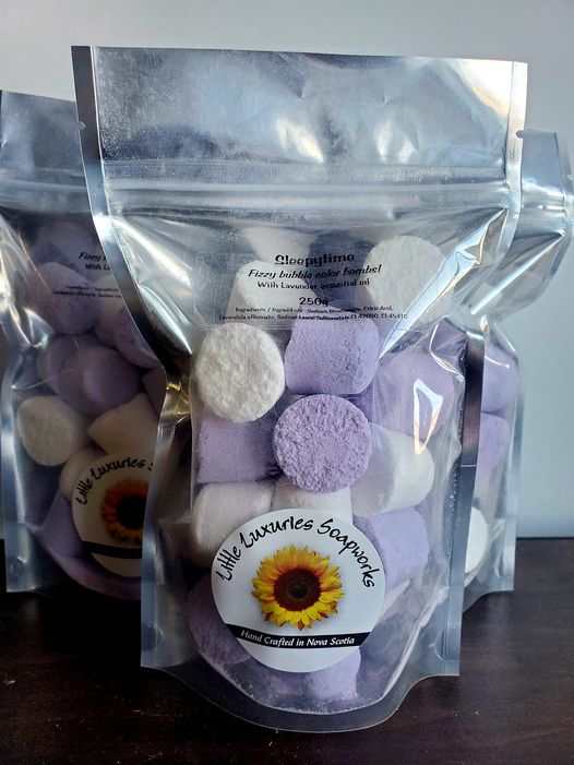Foaming bath bombs kit with purple and white colorful bombs in resealable pouch for relaxing, skin-friendly baths