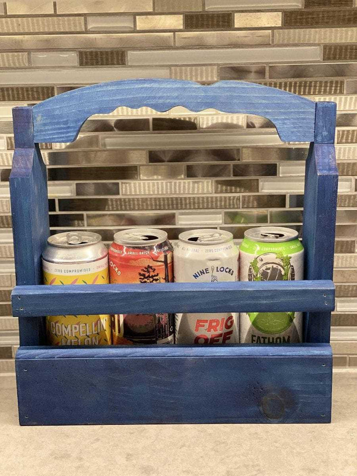Rustic beer caddy holding four cans, handcrafted from solid pine wood with a stylish blue finish.