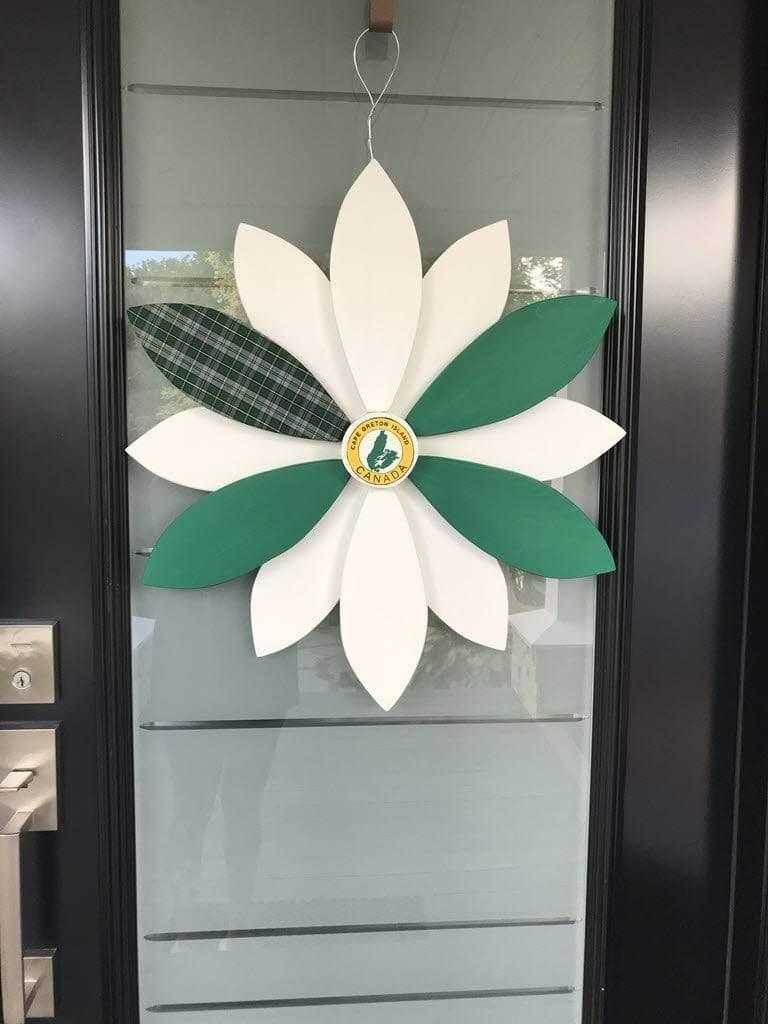 Handcrafted wooden flower door decoration with Cape Breton Tartan design.