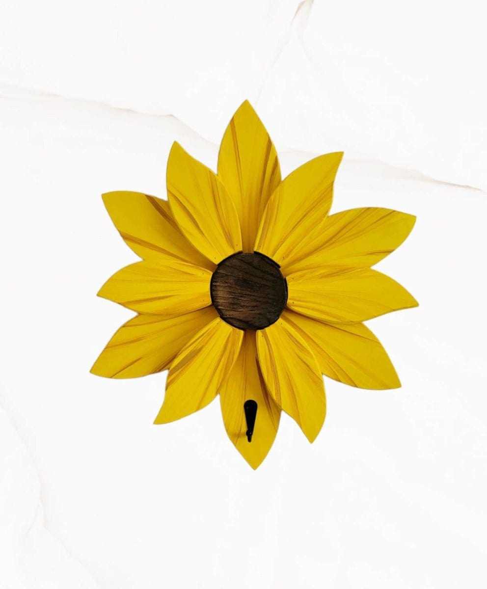 Yellow flower wall decoration with handcrafted wooden petals and vibrant colors.
