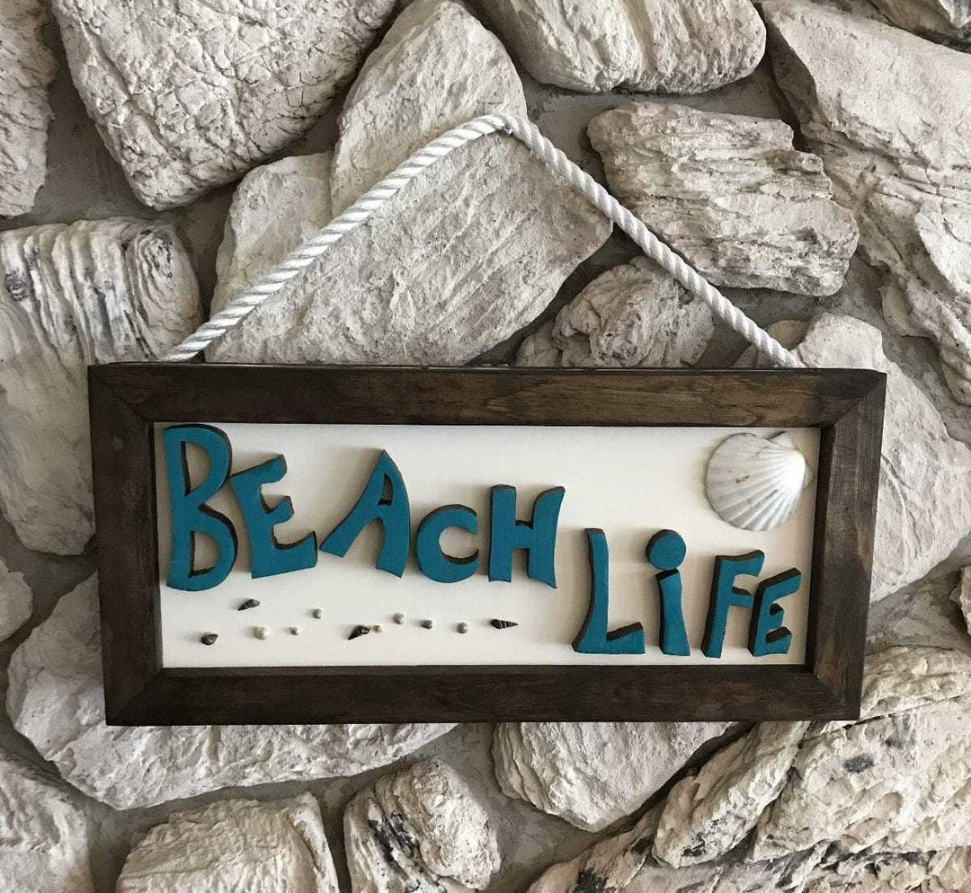 Hand-painted wooden beach life sign with shell décor, 24x11.5 inches, crafted for indoor and outdoor use.
