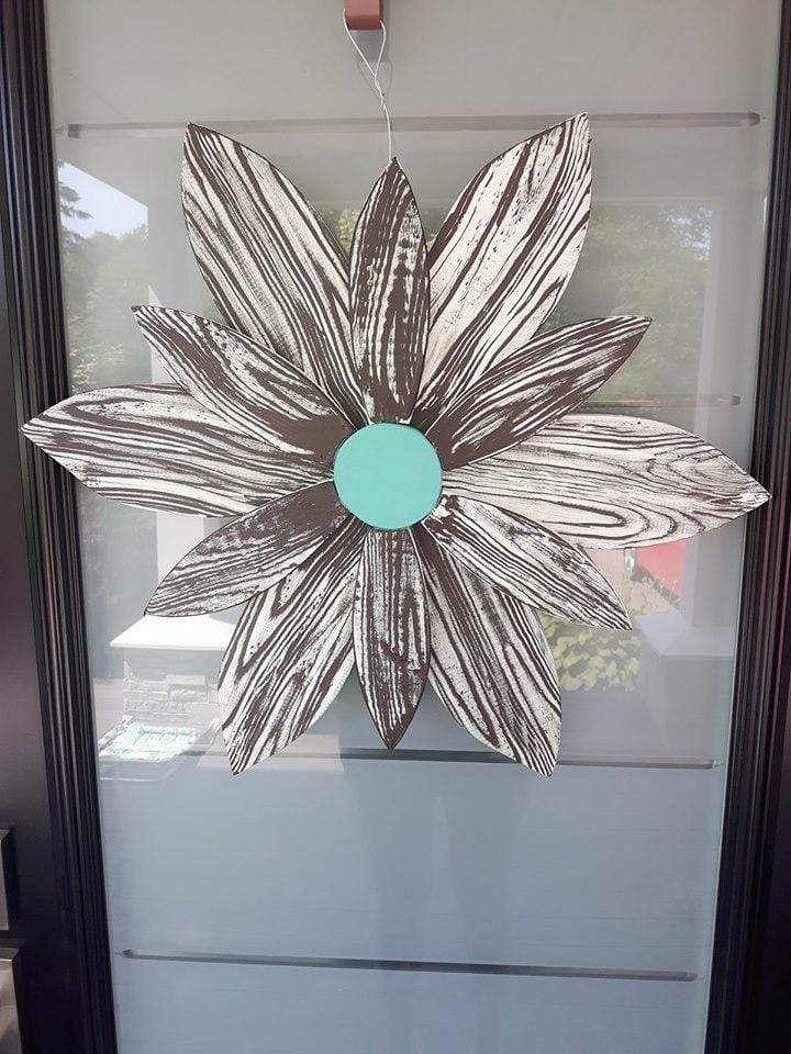 Handcrafted zebra-themed wooden flower decor with chocolate brown and white stripes.