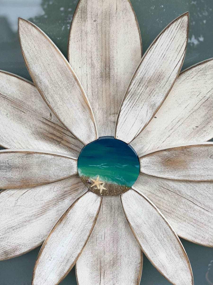White wood flower with a unique resin ocean-themed center, handcrafted by Woodnwares, Nova Scotia, for door decoration.