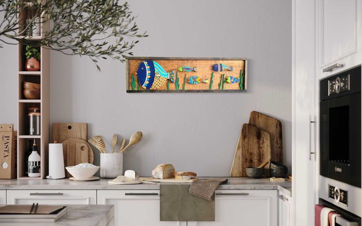 Handmade wooden fish wall art in kitchen, colorful and intricate design, 37.5" x 10.75".