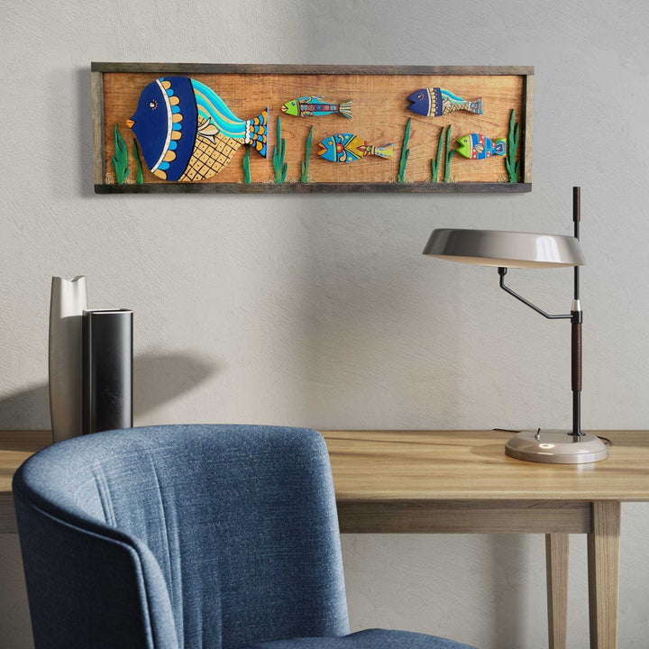 Handmade wooden fish wall art with vibrant hand-painted colors, 37.5" x 10.75", displayed above a desk for home or office decor.