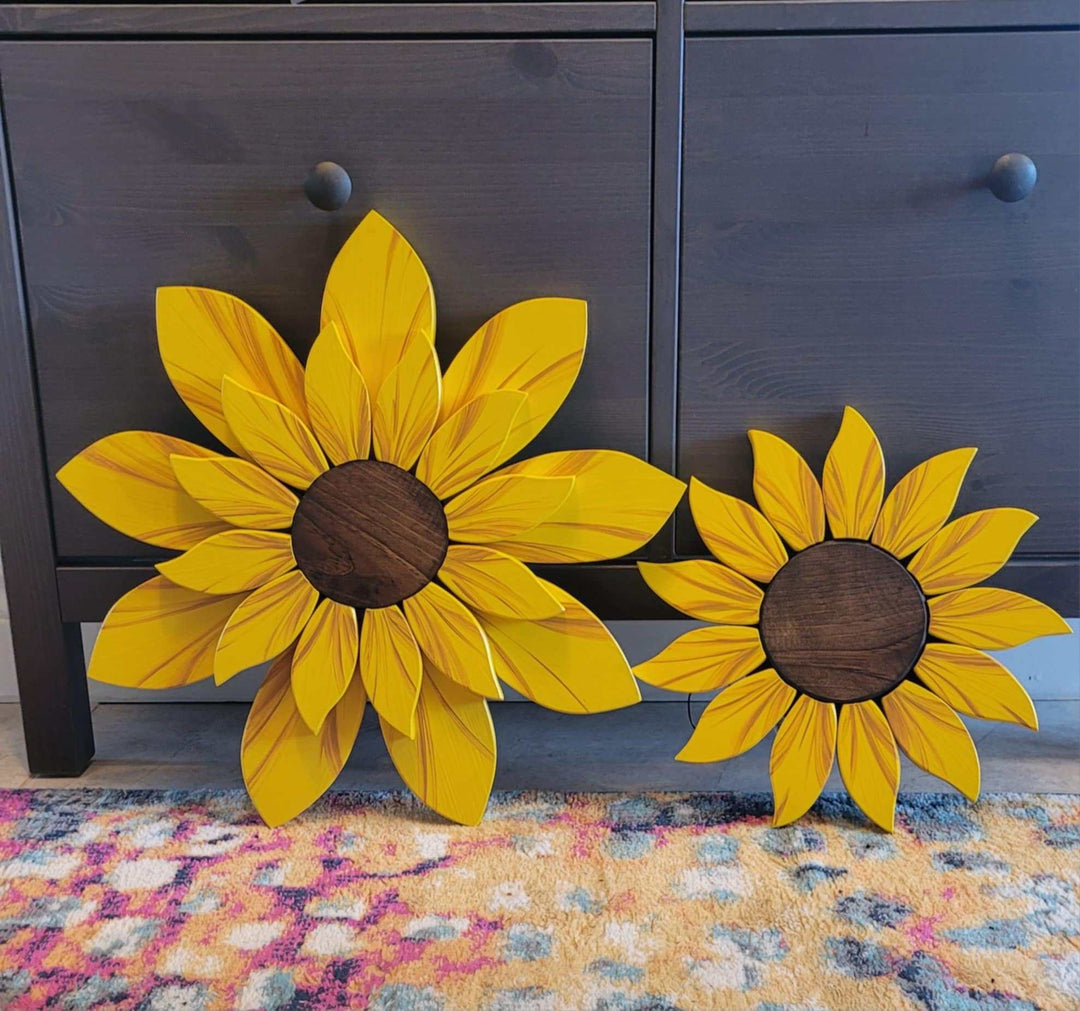 Handcrafted wooden sunflower front door decoration in two sizes, 12 and 17.5 inches, with realistic details for outdoor use.