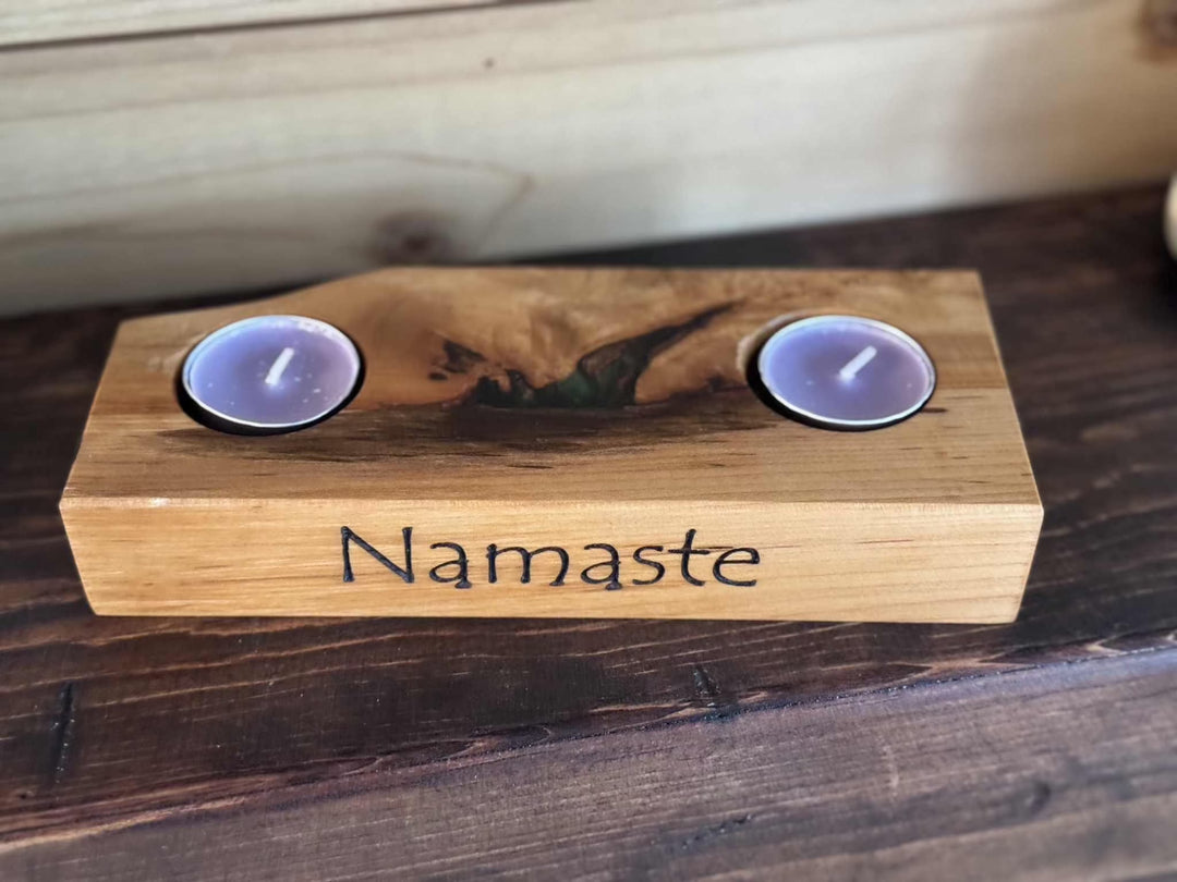 Handcrafted wooden tea light holder with "Namaste" engraving, featuring elegant natural wood grain and space for two tea lights.