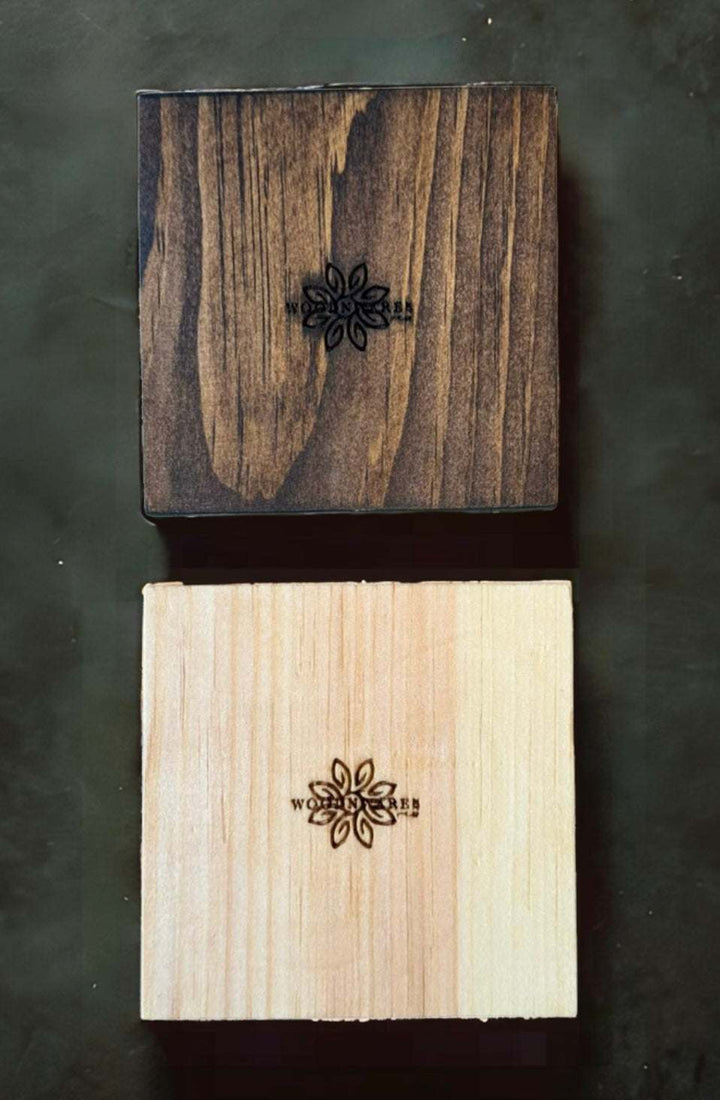 Handcrafted Nova Scotia wood coasters with natural and Dark Walnut finishes, laser engraved design.