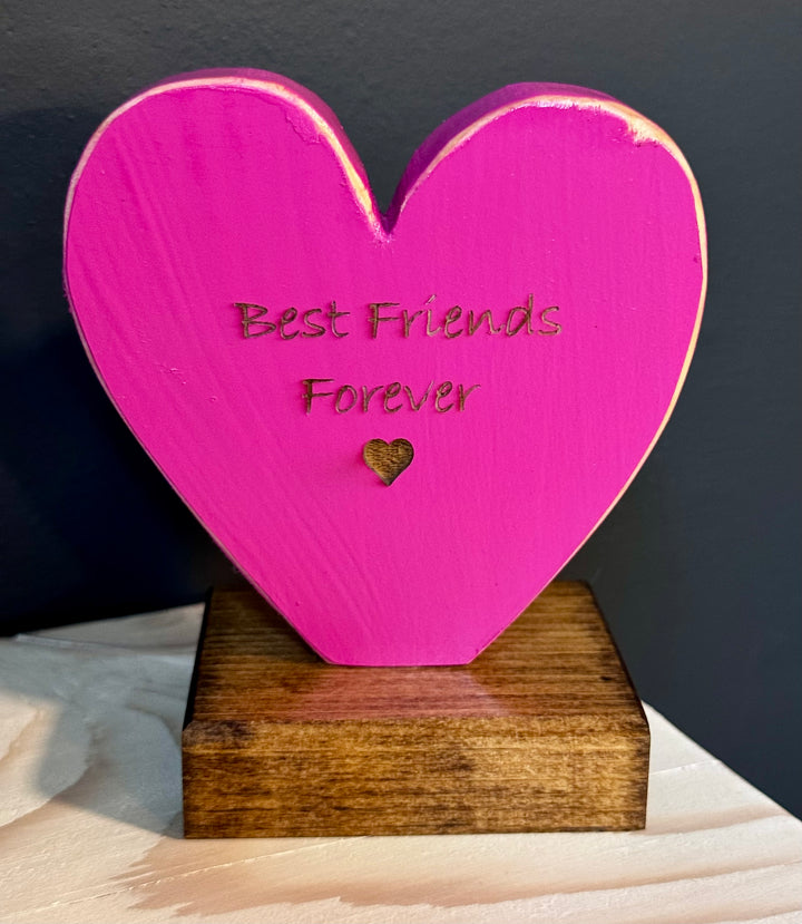 Pink heart-shaped wooden plaque with &