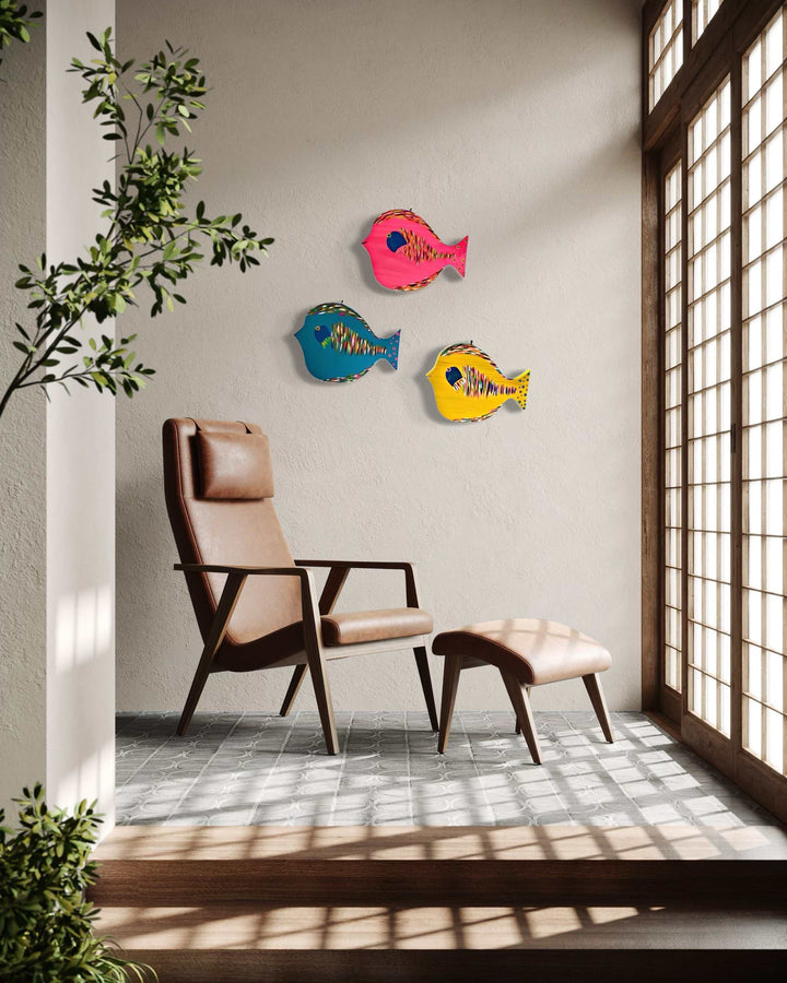 Hand painted folk art fish wall decor in modern room setting