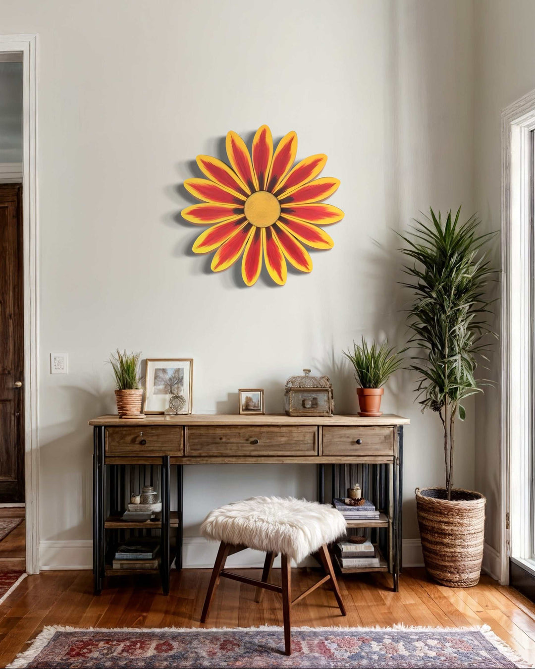 Handcrafted African Daisy Wooden Flower Art hanging on a wall above a wooden console table in a stylish room setting.