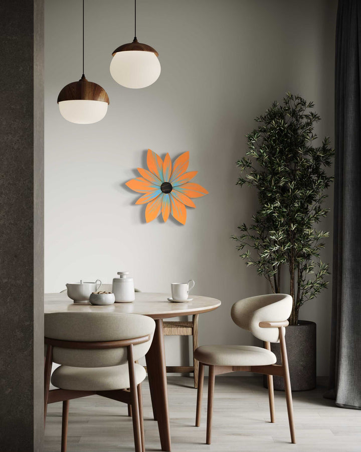 Handcrafted Nova Scotia wood flower art on wall, vibrant orange petals, modern interior setting.