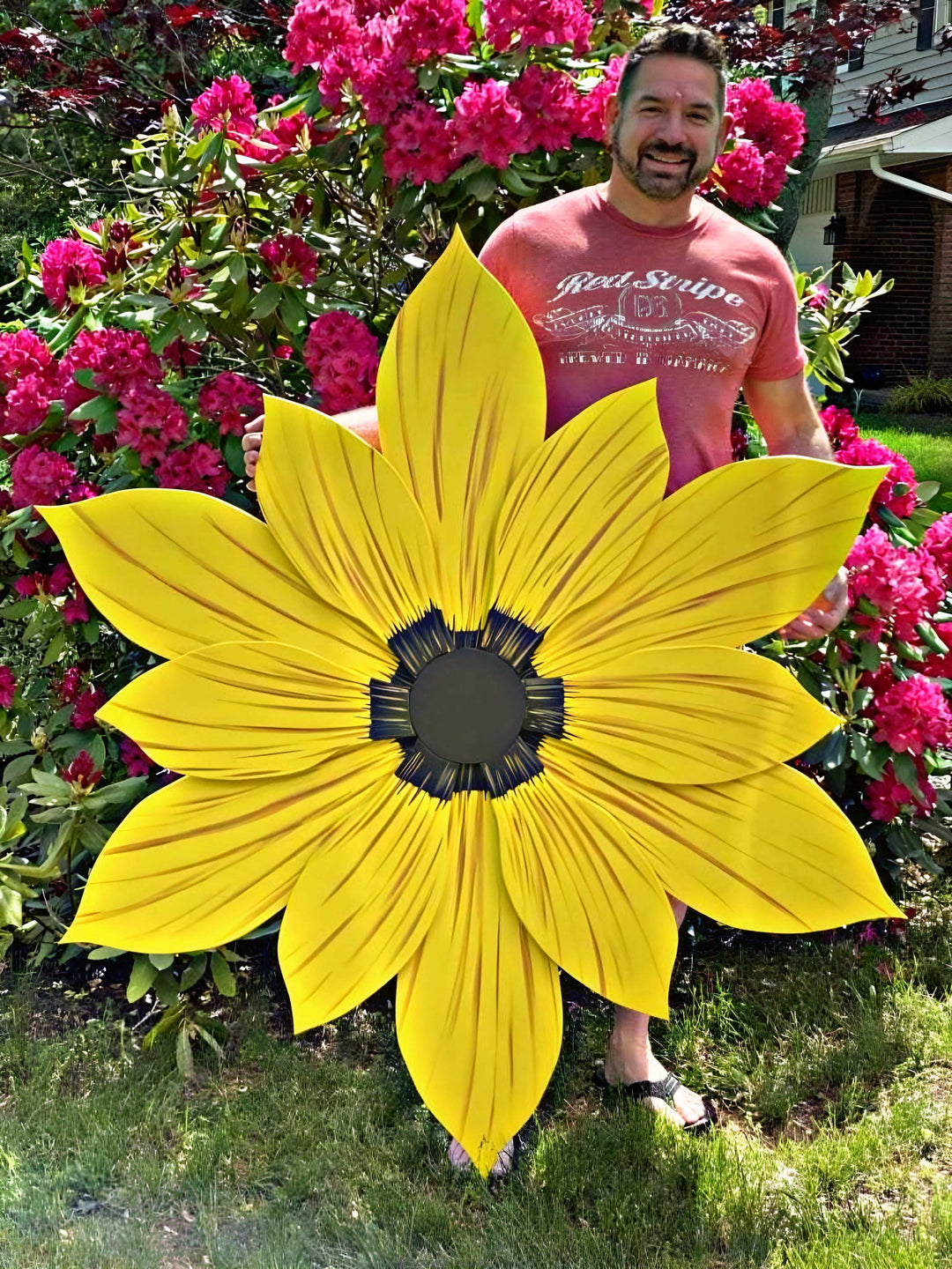 Giant wooden flower decoration in vibrant yellow, handcrafted from pine wood with painted petals, ideal for indoor or outdoor use.