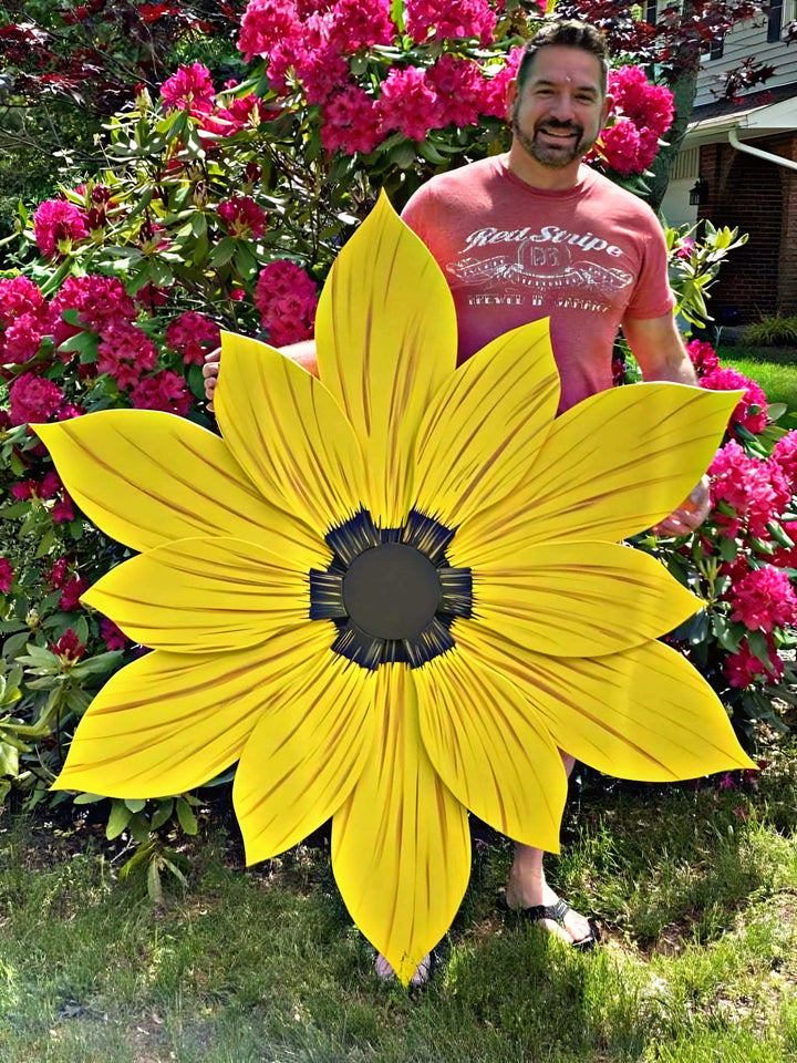 Giant wooden flower decoration in vibrant yellow, handcrafted from pine wood with painted petals, ideal for indoor or outdoor use.