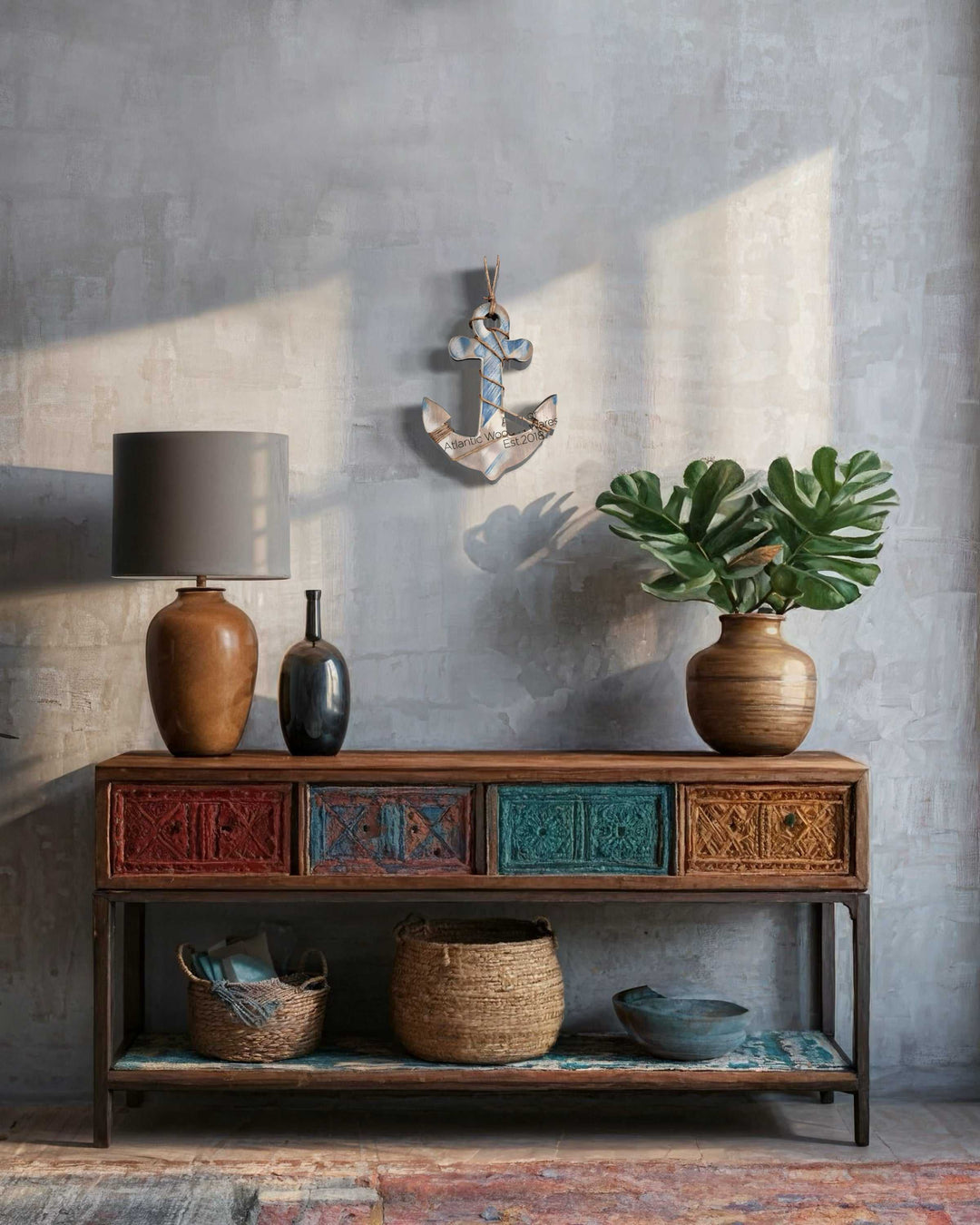 Rustic wooden anchor wall art with a weathered look above antique wooden console.