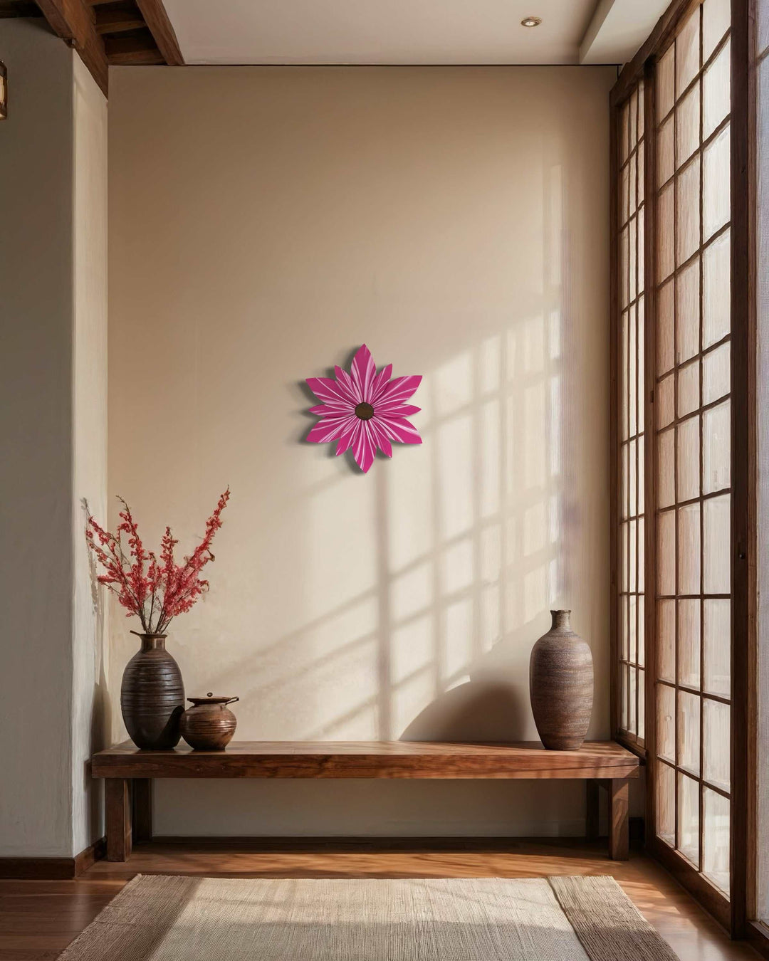 Hand-painted wooden flower door decor in vibrant pink, hanging on an interior wall.