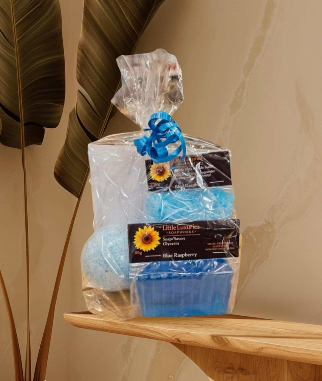 Gift pack set including soap, bath bomb, and bubble salts in elegant packaging.