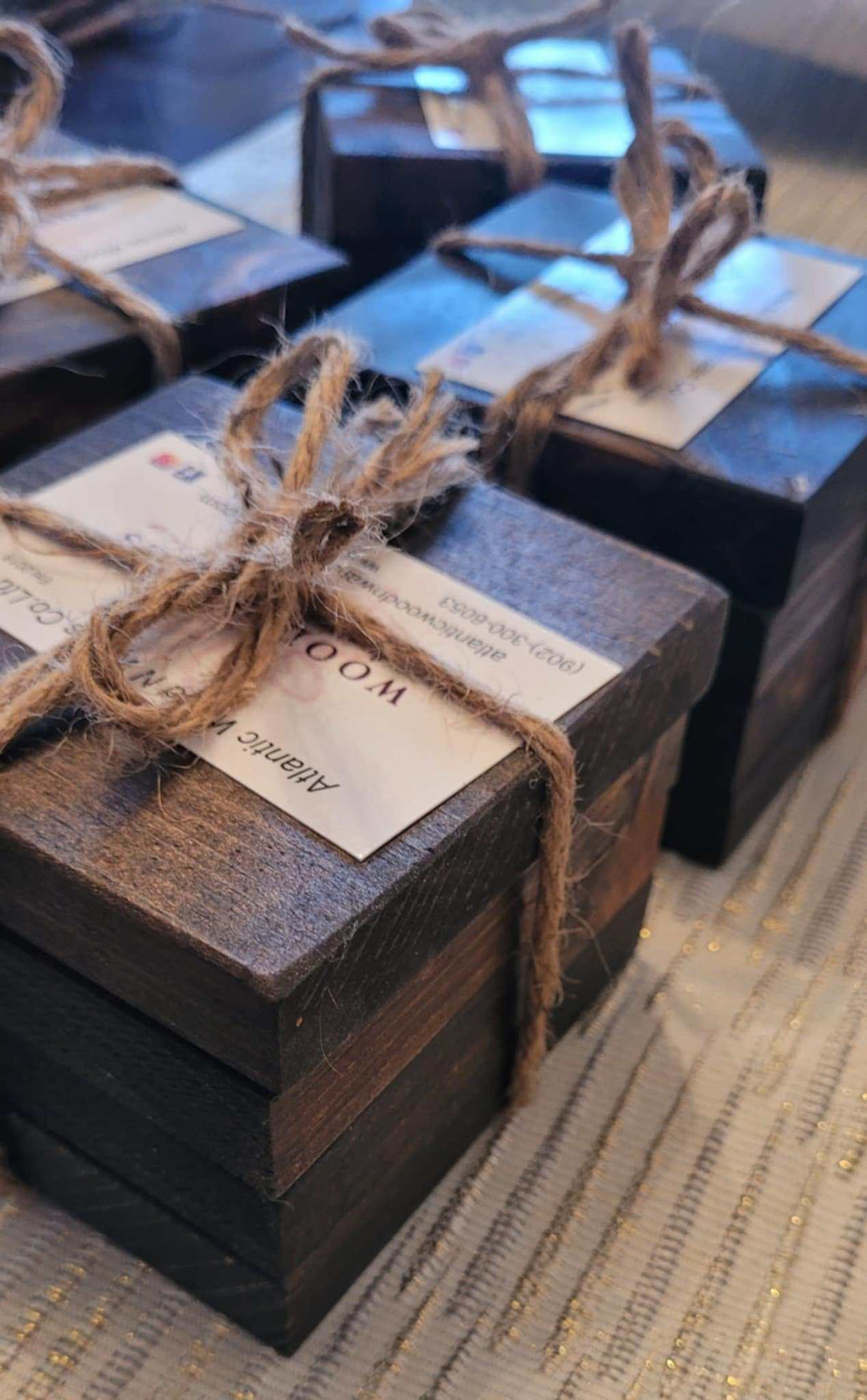 Set of 4 handcrafted rustic wood coasters tied with twine.