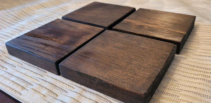 Set of 4 handcrafted rustic wood coasters made from high-quality pine, finished with Tung oil. Ideal for farmhouse, minimalist, or rustic decor.