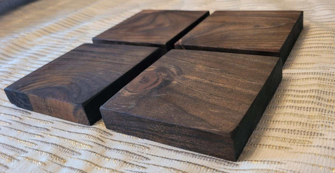 Set of four handcrafted rustic wood coasters made from pine, perfect for farmhouse and minimalist decor.