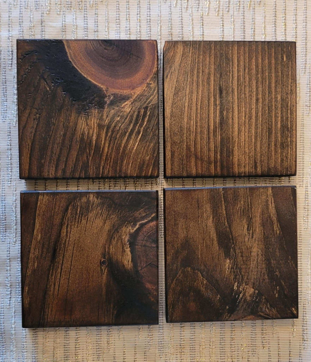 Handcrafted rustic wood coasters set of 4 made from sustainable pine wood with unique grain patterns.