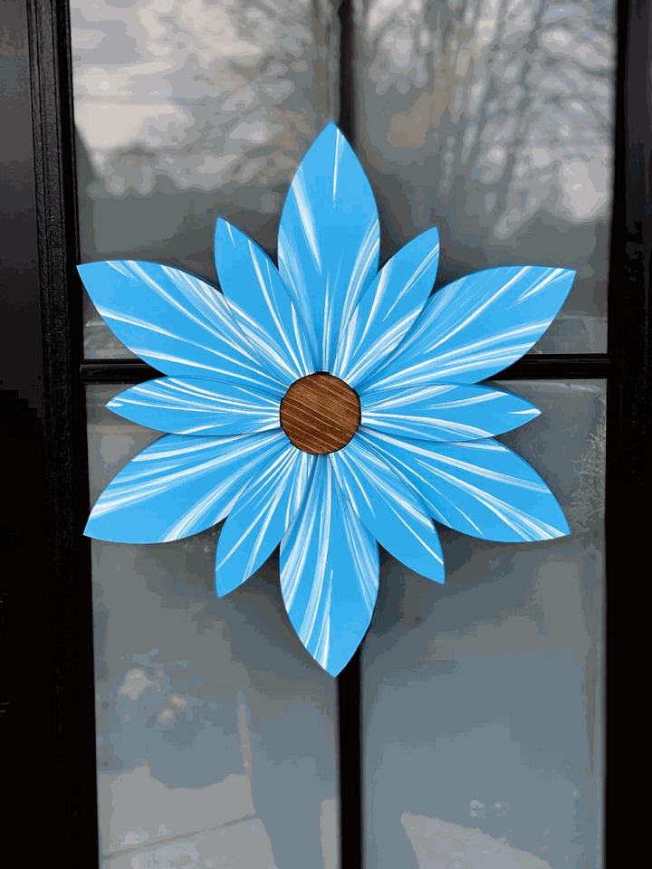 Handcrafted Bahama Sea Ocean Spray wood flower decoration with blue petals and brown center, suitable for indoor or outdoor use.