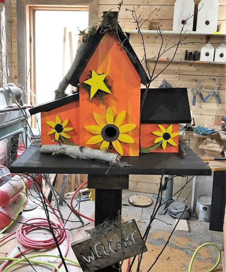 Colorful triple birdhouse with sunflower design, made from pine wood, for garden decor.
