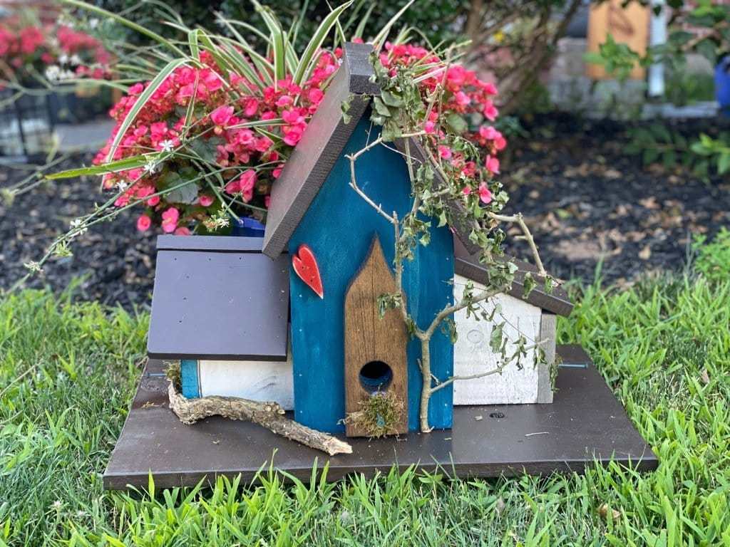Triple birdhouse with colorful design, featuring custom sayings and decorations, ideal bird lover gift for gardens.