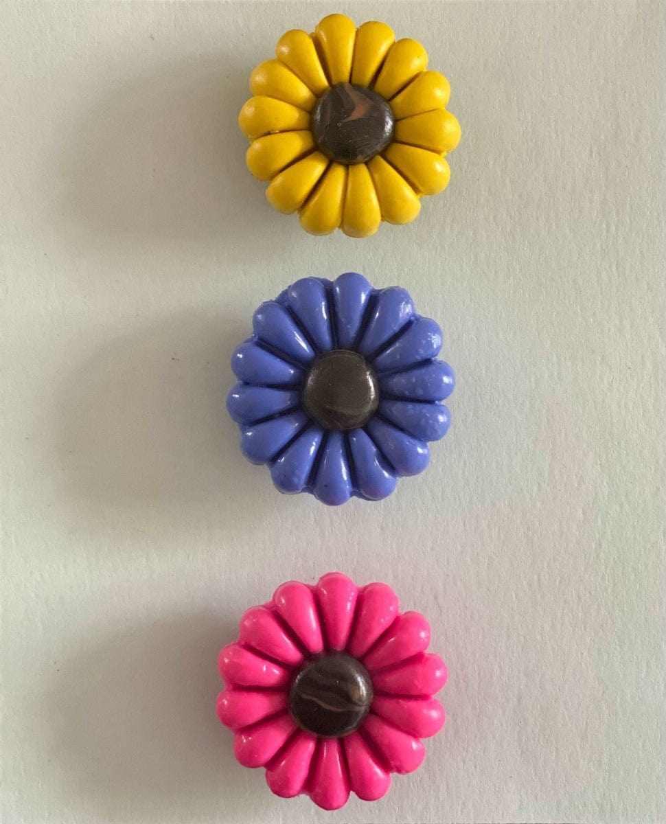 Colorful polyclay daisy fridge magnets set of three with proceeds supporting IWK Foundation.