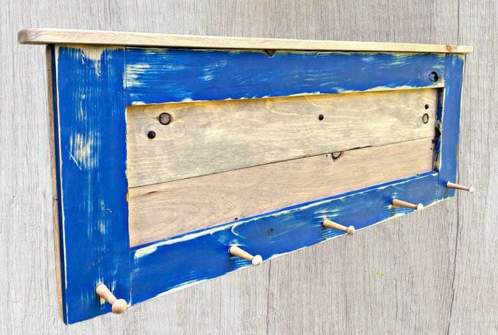 Handcrafted rustic coat rack with wooden pegs, solid pine wood, dark royal blue finish, weathered oak stain, modern design.