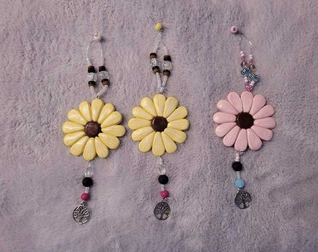 Sofia Daisy Car/Window Charms with polymer clay daisies, lava bead, and glass beads, supporting IWK Foundation.