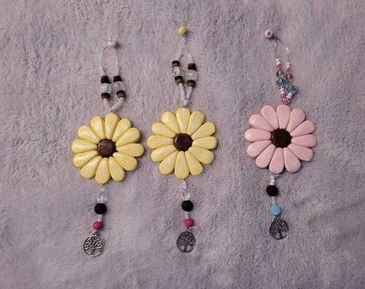 Sofia Daisy Car/Window Charms with polymer clay daisies, lava bead, and glass beads, supporting IWK Foundation.