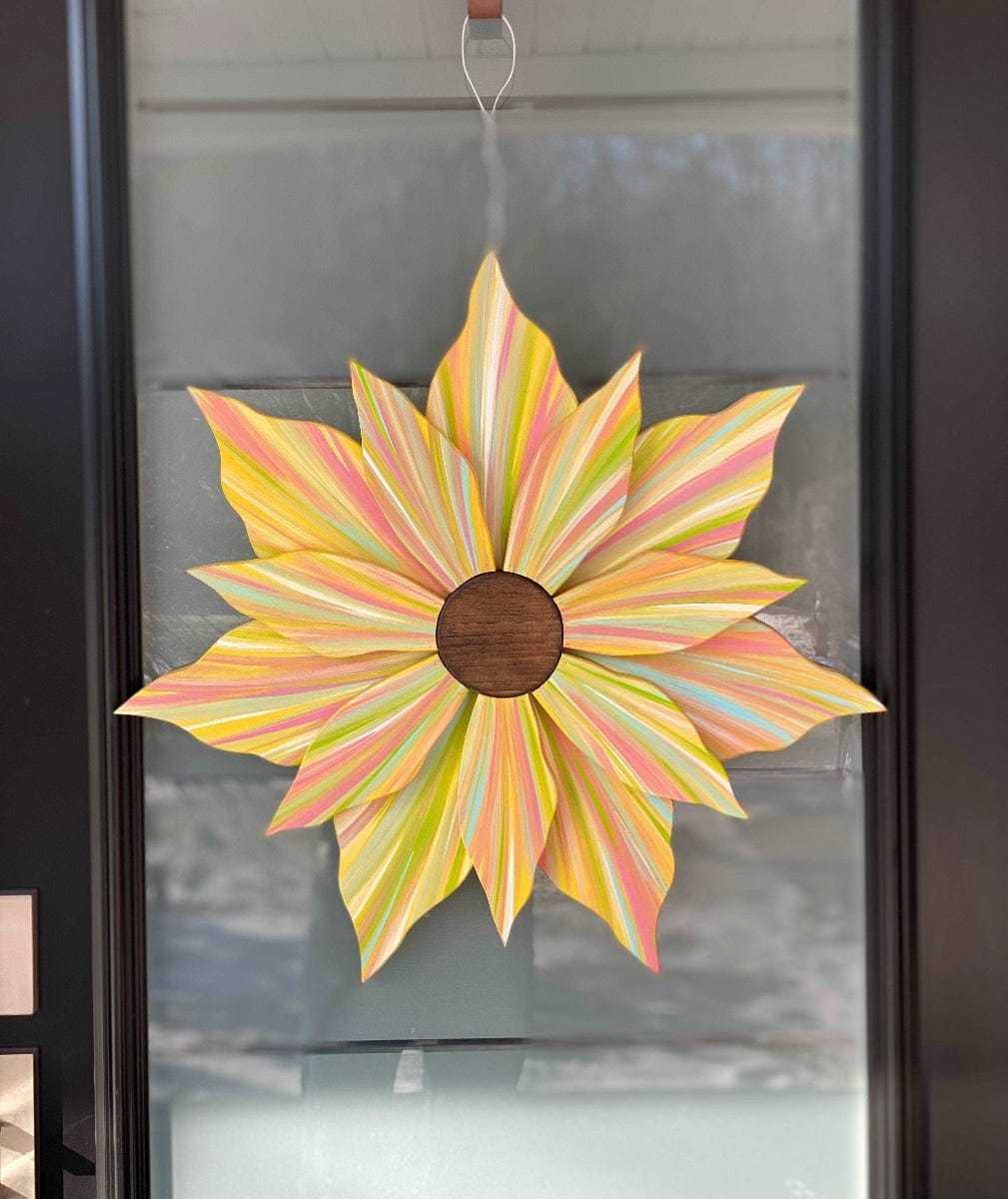 Handcrafted Love Flower Door Decoration with multicolored petals and gold center, 22x22 inches, suitable for all seasons.