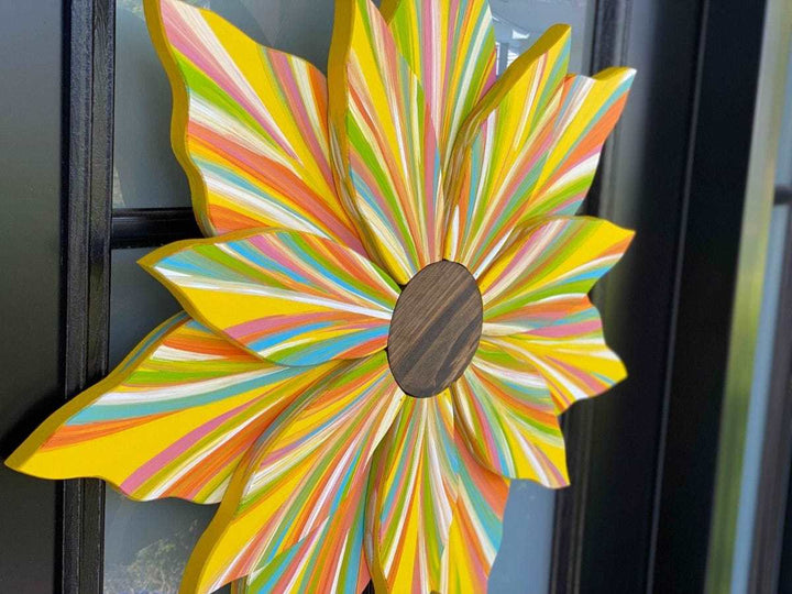 Handcrafted Love Flower Door Decoration with colorful petals and wooden center for all seasons.