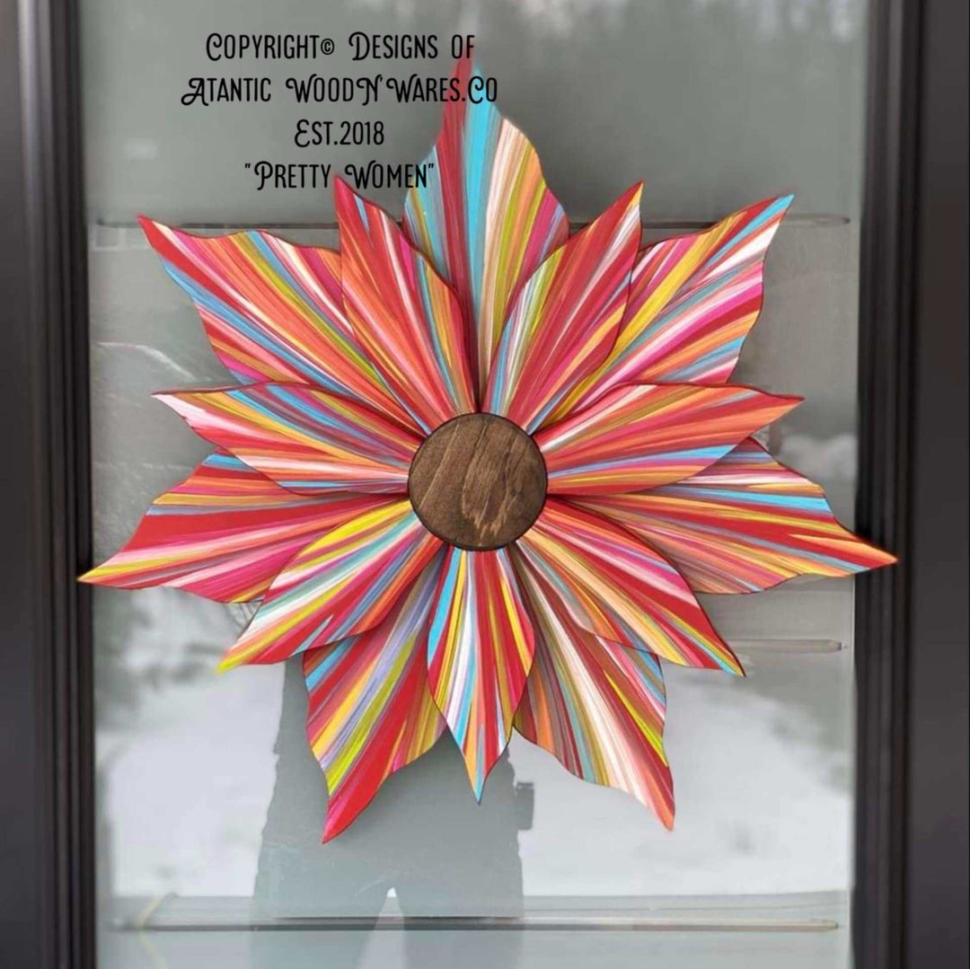 Handcrafted colorful flower door decoration with wooden center, painted for year-round elegance.