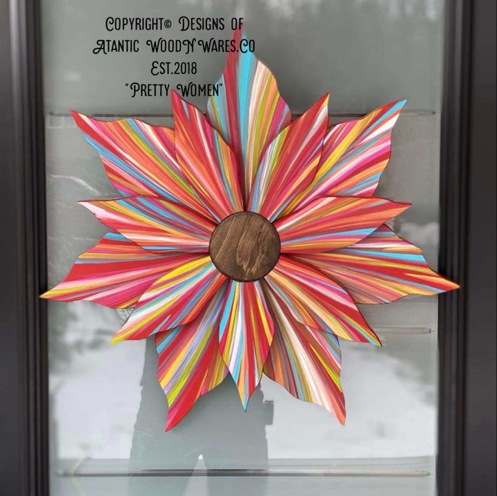 Handcrafted colorful flower door decoration with wooden center, painted for year-round elegance.