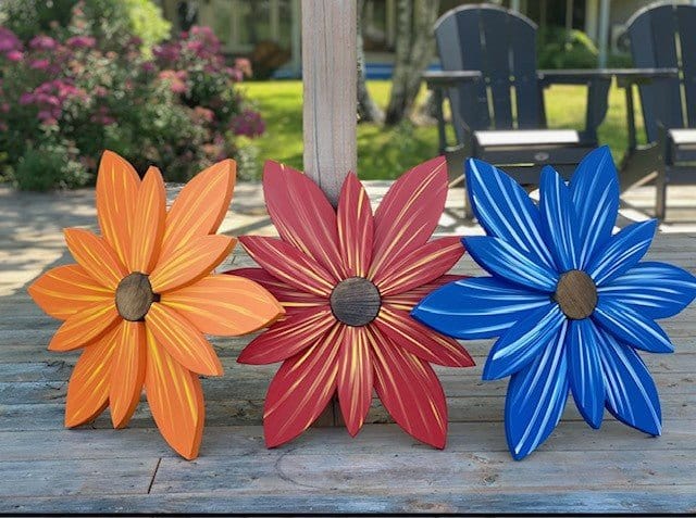 Handcrafted wooden flower trio in vibrant colors for unique home decor.