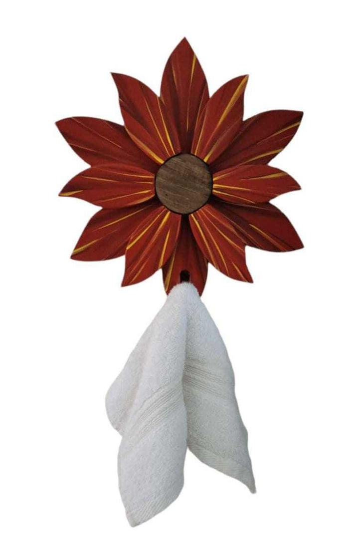 Handcrafted wooden flower wall decoration with painted pine petals and towel hanger.