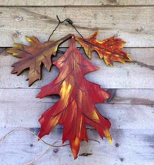 Handmade colorful oak leaf decor for fall made from painted pine wood.