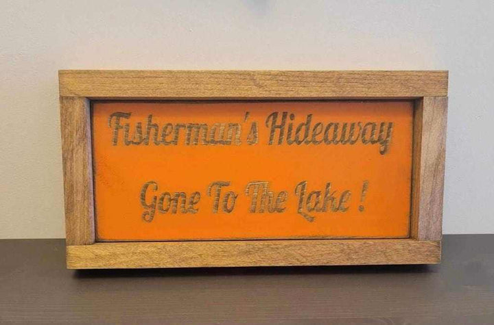 Laser engraved wood sign for outdoor enthusiasts with "Fisherman's Hideaway - Gone To The Lake" design.