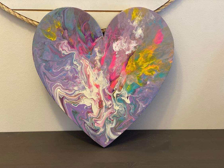 Handcrafted artisan wooden hearts wall art with colorful acrylic paints, unique design.