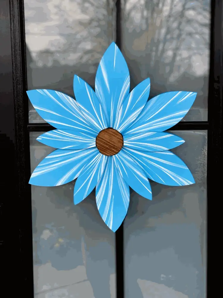Handcrafted Bahama Sea Ocean Spray wood flower decoration with blue petals and brown center, suitable for indoor or outdoor use.
