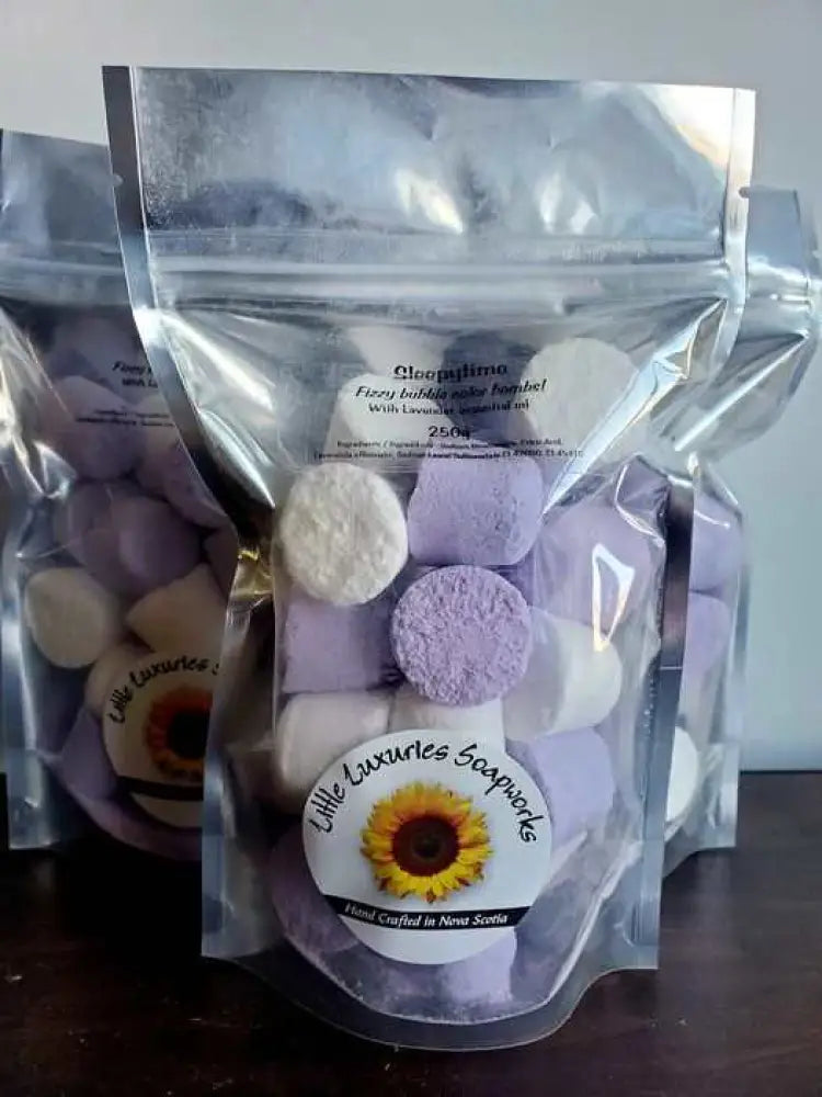 Foaming bath bombs kit with purple and white colorful bombs in resealable pouch for relaxing, skin-friendly baths