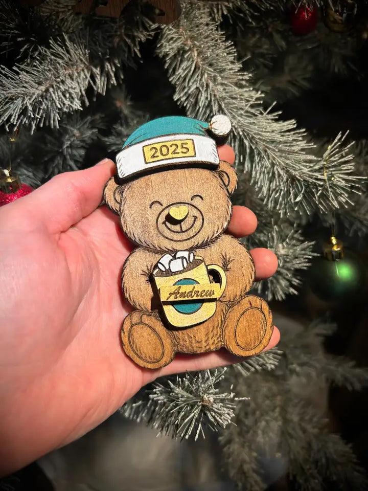 Custom wooden bear ornament with teal and white 2025 Santa hat holding Andrew mug