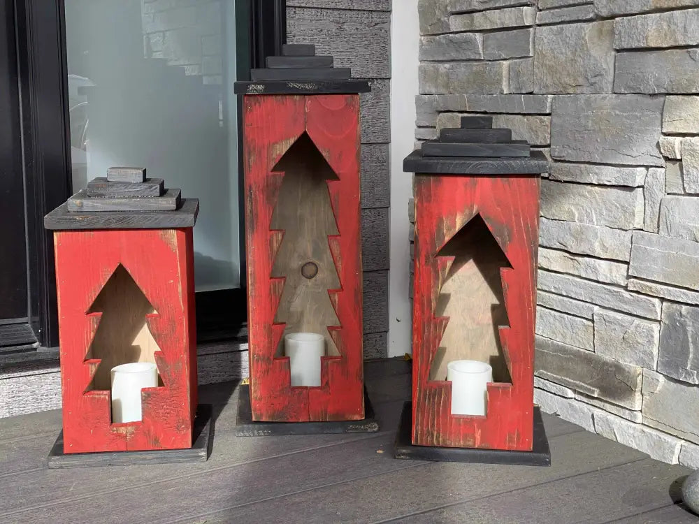 Handcrafted wooden lanterns with intricate designs and red finish, perfect for indoor or outdoor decor.