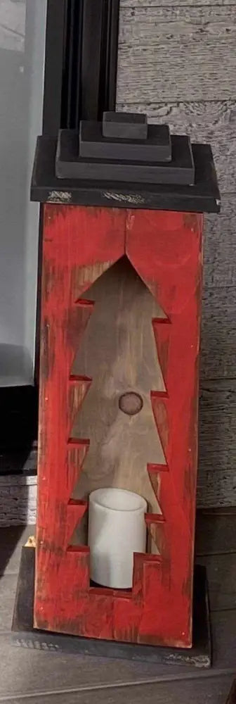 Handcrafted wooden lantern with intricate design and candle placeholder.