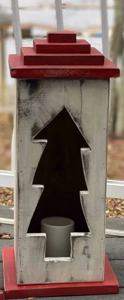 Handcrafted wooden lantern with intricate design and warm glow.