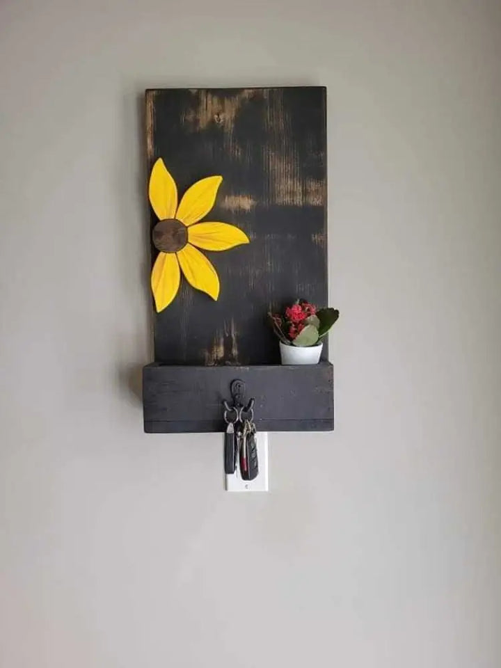 Entryway key chain holder with sunflower design made from pine wood, featuring double hooks and a decorative plant.
