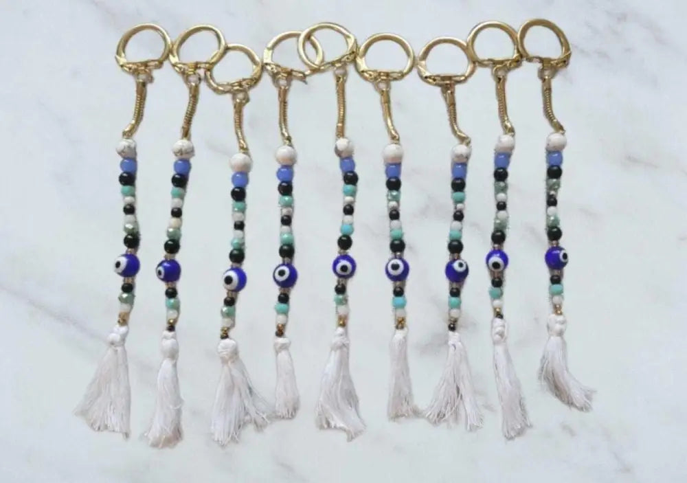 Evil Eye keychain with glass stones, howlite, macramé tassel, and gold locking ring.