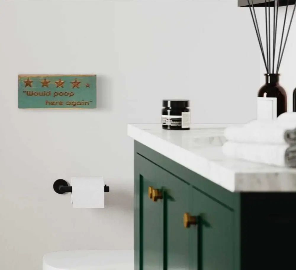 Rustic "Would Poop Here Again" bathroom sign with stars, adding humor to decor.